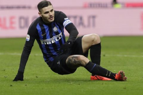 Inter Milan's Mauro Icardi sits on the pitch during a Serie A soccer match between Inter Milan and Sassuolo, at the San Siro stadium in Milan, Italy, Saturday, Jan. 19, 2019. (AP Photo/Luca Bruno)