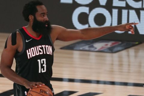 Houston Rockets guard James Harden brings the ball upcourt against the Oklahoma City Thunder during the first half of Game 4 of an NBA basketball first-round playoff series, Monday, Aug. 24, 2020, in Lake Buena Vista, Fla. (Kim Klement/Pool Photo via AP)