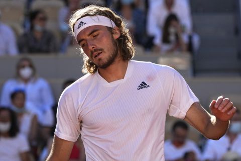 Stefanos Tsitsipas of Greece reacts as he plays Serbia's Novak Djokovic during their final match of the French Open tennis tournament at the Roland Garros stadium Sunday, June 13, 2021 in Paris. (AP Photo/Michel Euler)