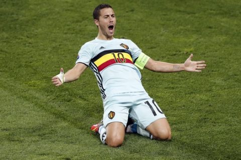 Belgium's Eden Hazard, right, celebrates scoring his side's 3rd goal during the Euro 2016 round of 16 soccer match between Hungary and Belgium, at the Stadium municipal in Toulouse, France, Sunday, June 26, 2016. (AP Photo/Francois Mori)