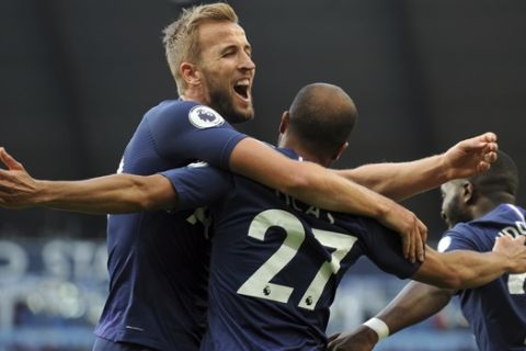 Tottenham's Lucas Moura, center, celebrates with Tottenham's Harry Kane, left, after scoring his side's second goal during the English Premier League soccer match between Manchester City and Tottenham Hotspur at Etihad stadium in Manchester, England, Saturday, Aug. 17, 2019. (AP Photo/Rui Vieira)