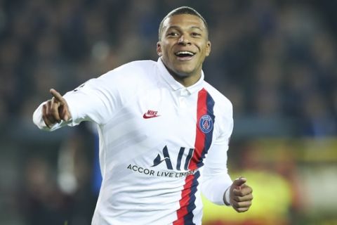 PSG's Kylian Mbappe jubilates after scoring during a Champions League Group A soccer match between Club Brugge and Paris Saint Germain at the Jan Breydel stadium in Bruges, Belgium, Tuesday, Oct. 22, 2019. (AP Photo/Francisco Seco)