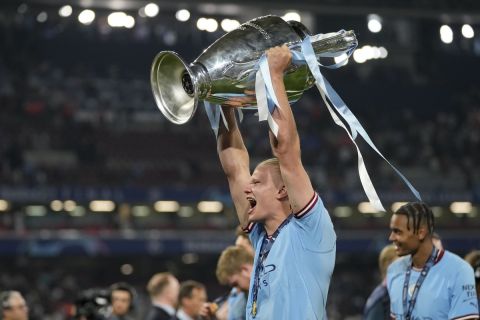 Manchester City's Erling Haaland celebrates with the trophy after winning the Champions League 