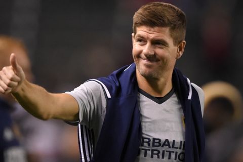 Los Angeles Galaxy midfielder Steven Gerrard, of England, gestures to fans after a soccer match against Club Tijuana, Tuesday, Feb. 9, 2016, in Carson, Calif. The match ended in a 0-0 tie. (AP Photo/Mark J. Terrill) 
