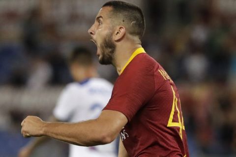 Roma's Kostas Manolas celebrates after scoring during a Serie A soccer match between Roma and Atalanta, in Rome's Olympic stadium, Monday, Aug. 27, 2018. (AP Photo/Andrew Medichini)