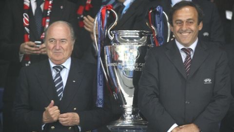 UEFA President Michel Platini, right, and FIFA Sepp Blatter wait for the start of the presentation ceremony at the end of the Champions League Final soccer match between AC Milan and Liverpool at the Olympic Stadium in Athens Wednesday May 23, 2007. Milan won the match 2-1.  (AP Photo/Jon Super)