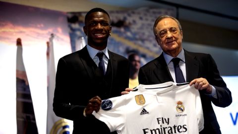 Brazilian soccer player Vinicius Jr, left, and Real Madrid President Florentino Perez pose for the media during his official presentation for Real Madrid at the Santiago Bernabeu stadium in Madrid, Spain, Friday, July 20, 2018. (AP Photo/Francisco Seco)