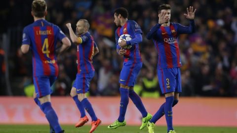 Barcelona players celebrate after PSG's Layvin Kurzawa scored an own goal during the Champion's League round of 16, second leg soccer match between FC Barcelona and Paris Saint Germain at the Camp Nou stadium in Barcelona, Spain, Wednesday March 8, 2017. (AP Photo/Manu Fernandez)