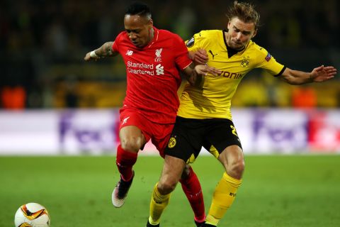 "DORTMUND, GERMANY - APRIL 07:  Nathaniel Clyne of Liverpool and Marcel Schmelzer of Borussia Dortmund battle for the ball during the UEFA Europa League quarter final first leg match between Borussia Dortmund and Liverpool at Signal Iduna Park on April 7, 2016 in Dortmund, Germany.  (Photo by Lars Baron/Bongarts/Getty Images)"