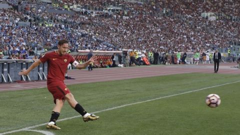 Roma's Francesco Totti shoots the ball during an Italian Serie A soccer match between Roma and Genoa at the Olympic stadium in Rome, Sunday, May 28, 2017. Francesco Totti is playing his final match with Roma against Genoa after a 25-season career with his hometown club. (AP Photo/Alessandra Tarantino)
