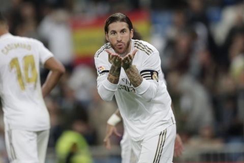 Real Madrid's Sergio Ramos celebrates after scoring his side's third goal, from a penalty kick during a Spanish La Liga soccer match between Real Madrid and Leganes at the Santiago Bernabeu stadium in Madrid, Spain, Wednesday, Oct. 30, 2019. (AP Photo/Bernat Armangue)