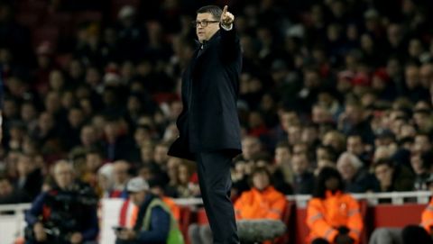 Red Star's head coach Vladan Milojevic gestures during a Group H Europa League soccer match between Arsenal London and Red Star Belgrade at the Emirates stadium in London, Britain, Thursday, Nov. 2, 2017. (AP Photo/Tim Ireland)