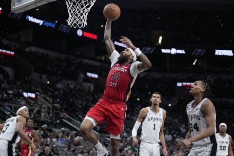 New Orleans Pelicans forward Brandon Ingram (14) drives to the basket against the San Antonio Spurs during the second half of an NBA basketball game in San Antonio, Sunday, Dec. 17, 2023. (AP Photo/Eric Gay)
