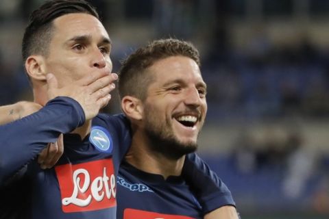 Napoli's Jose Callejon, left, celebrates with his teammate Dries Mertens after scoring during a Serie A soccer match between Lazio and Napoli, at the Rome Olympic stadium, Wednesday, Sept. 20, 2017. (AP Photo/Alessandra Tarantino)
