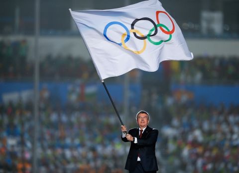 NANJING, CHINA - AUGUST 28: International Olympic Committee (IOC) President Thomas Bach waves the Olympic flag during the Closing Ceremony of Nanjing 2014 Summer Youth Olympic Games at the Nanjing Olympic Sports Centre on August 28, 2014 in Nanjing, China.  (Photo by Lintao Zhang/Getty Images)
