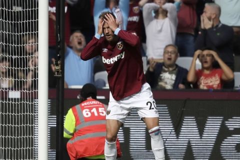 West Ham's Andriy Yarmolenko reacts after missing a chance to score during the English Premier League soccer match between West Ham United and Chelsea at London Stadium in London, Sunday, Sept. 23, 2018. (AP Photo/Matt Dunham)