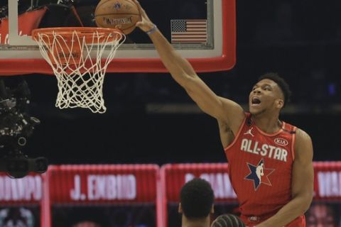 Giannis Antetokounmpo of the Milwaukee Bucks dunks during the first half of the NBA All-Star basketball game Sunday, Feb. 16, 2020, in Chicago. (AP Photo/Nam Huh)