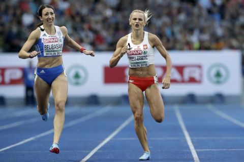 Greece's silver medalist Maria Belibasaki, left, and Poland's gold medalist Justyna Swiety-Ersetic ceopmete during a women's 400 meter final race at the European Athletics Championships in Berlin, Germany, Saturday, Aug. 11, 2018. (AP Photo/Michael Sohn)