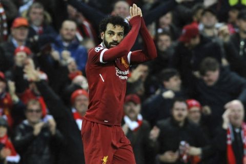 Liverpool's Mohamed Salah celebrates after scoring his side's opening goal during the Champions League semifinal, first leg, soccer match between Liverpool and Roma at Anfield Stadium, Liverpool, England, Tuesday, April 24, 2018. (AP Photo/Rui Vieira)