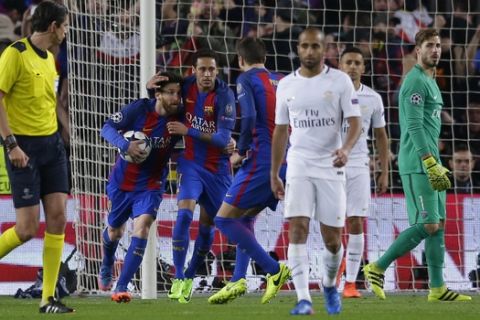 Barcelona's Lionel Messi, left, celebrates scoring his side's 2nd goal from a penalty during the Champions League round of 16, second leg soccer match between FC Barcelona and Paris Saint Germain at the Camp Nou stadium in Barcelona, Spain, Wednesday March 8, 2017. (AP Photo/Manu Fernandez)