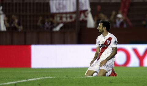 Argentina's River Plate Ignacio Scocco sits on the grass during a semifinals Copa Libertadores soccer match against Lanus in Buenos Aires, Argentina, Tuesday, Oct. 31, 2017. (AP Photo/Natacha Pisarenko)