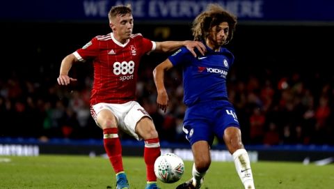 Chelsea's Ethan Ampadu, right, vies for the ball with Nottingham Forest's Ben Osborn during the English League Cup soccer match between Chelsea and Nottingham Forest at Stamford Bridge stadium in London, Wednesday, Sept. 20, 2017. (AP Photo/Kirsty Wigglesworth)