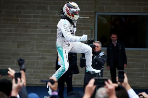 AUSTIN, TX - OCTOBER 25:  Lewis Hamilton of Great Britain and Mercedes GP jumps in the air in Parc Ferme after winning the United States Formula One Grand Prix and the championship at Circuit of The Americas on October 25, 2015 in Austin, United States.  (Photo by Mark Thompson/Getty Images)