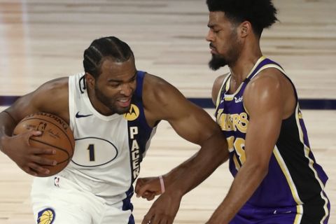 Indiana Pacers forward T.J. Warren (1) drives against Los Angeles Lakers guard Quinn Cook (28) during the fourth quarter of an NBA basketball game Saturday, Aug. 8, 2020, in Lake Buena Vista, Fla. (Kim Klement/Pool Photo via AP)
