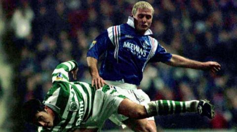 Rangers Paul Gascoigne, right, and David Hannah of Celtic battle for the ball during their Thursday evening's match at Ibrox, Glasgow, Jan.2 1997. Rangers defeated Celtic 3-1. (AP Photo/PA-Chris Bacon) UNITED KINGDOM OUT