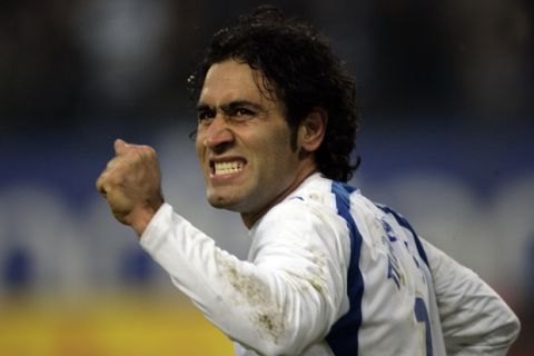 Hamburg's Mehdi Mahdavikia from Iran celebrates after scoring 3-0 during the German first soccer division match between Hamburger SV and Borussia Dortmund in the AOL Arena, Hamburg, northern Germany on Saturday, Feb, 10. 2007. Hamburg won 3-0. (AP Photo/Kai-Uwe Knoth) ** NO MOBILE USE UNTIL 2 HOURS AFTER THE MATCH, WEBSITE USERS ARE OBLIGED TO COMPLY WITH DFL-RESTRICTIONS, SEE INSTRUCTIONS FOR DETAILS **