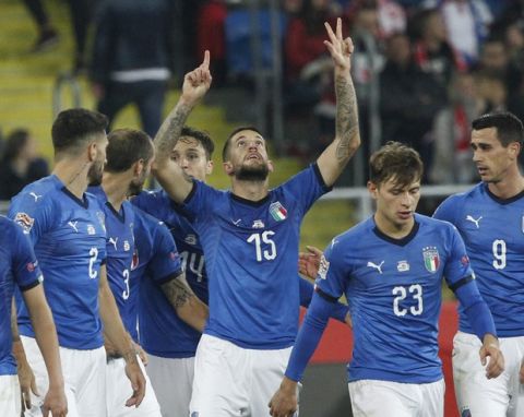 Italy's Cristiano Biraghi, center, celebrate with his teammates after scoring the winning goal during the UEFA Nations League soccer match between Poland and Italy at the Silesian Stadium Chorzow, Poland, Sunday Oct. 14, 2018. Italy won 1-0. (AP Photo/Czarek Sokolowski)