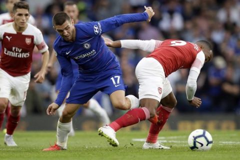 Chelsea's Mateo Kovacic fights for the ball with Arsenal's Alexandre Lacazette, right, during the English Premier League soccer match between Chelsea and Arsenal at Stamford bridge stadium in London, Saturday, Aug. 18, 2018. (AP Photo/Tim Ireland)