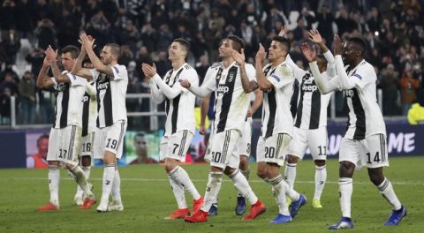Juventus players celebrate at the end of the Champions League group H soccer match between Juventus and Valencia at the Allianz stadium in Turin, Italy, Tuesday, Nov. 27, 2018. (AP Photo/Antonio Calanni)