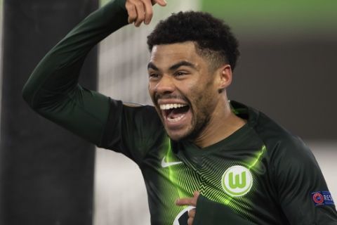 Wolfsburg's Paulo Otavio celebrates scoring the first goal of the game during their Europa League Group I soccer match between VfL Wolfsburg and Saint-Etienne at the Volkswagen Arena in Wolfsburg, Germany, Thursday, Dec. 12, 2019. (Swen Pfoertner/dpa via AP)