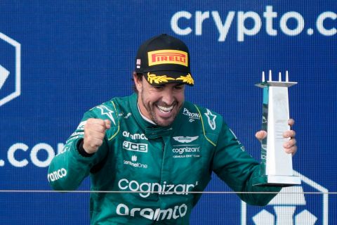 Fernando Alonso celebrates on the podium after finishing third in the Formula One Miami Grand Prix auto race at the Miami International Autodrome, Sunday, May 7, 2023, in Miami Gardens, Fla. (AP Photo/Wilfredo Lee)