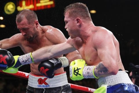 Canelo Alvarez connects a punch against Sergey Kovalev to knock him out during a light heavyweight WBO title bout, Saturday, Nov. 2, 2019, in Las Vegas (AP Photo/John Locher)