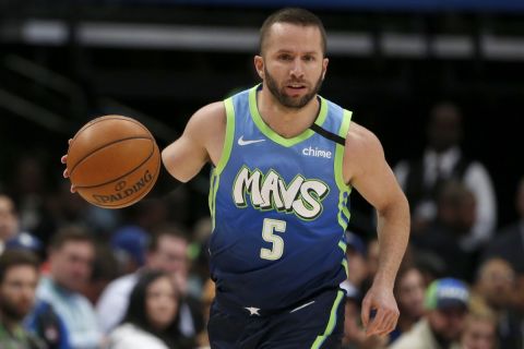 Dallas Mavericks guard J.J. Barea (5) moves the ball up the court against the Utah Jazz during the first half an NBA basketball game in Dallas, Monday, Feb. 10, 2020. (AP Photo/Michael Ainsworth)