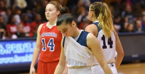 Robert Morris guard Anna Niki Stamolamprou walks to the lane as St. Francis forward Sarah Benedetti (14) waits at the foul line late in the second half of the Northeast Conference Championship NCAA college basketball game on Sunday, March 15, 2015, in Moon, Pa. St. Francis won 77-62. (AP Photo/Don Wright)