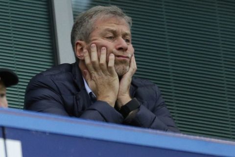 FILE - In this file photo dated Saturday, Dec. 19, 2015, Chelsea soccer club owner Roman Abramovich sits in his box before the English Premier League soccer match between Chelsea and Sunderland at Stamford Bridge stadium in London.  According to a joint statement Monday Aug. 7, 2017, 50-year old Russian tycoon Roman Abramovich and his wife Dasha Zhukova have announced their impending divorce, after ten years together. (AP Photo/Matt Dunham, FILE)