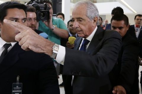 River Plate's President Rodolfo D' Onofrio, leaves a hotel before meeting Boca Junior's President Daniel Angelici, of Argentina, and Conmebol President, Paraguay's Alejandro Dominguez, at his headquarter in Luque, Paraguay, Tuesday, Nov. 27, 2018. The Argentines major club leaders disagreed about the completion of the Copa Libertadores final. (AP Photo/Jorge Saenz)