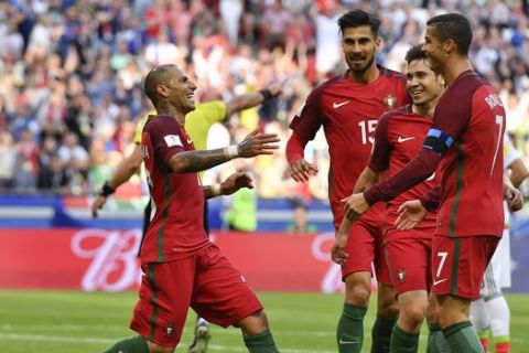 Portugal's Ricardo Quaresma, left, celebrates after scoring his side's first goal during the Confederations Cup, Group A soccer match between Portugal and Mexico, at the Kazan Arena, Russia, Sunday, June 18, 2017. (AP Photo/Martin Meissner)