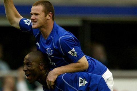 Everton's Wayne Rooney (top) celebrates scoring the winning goal against visitors Arsenal, at end of game with Kevin Campbell, during their FA Barclaycard premiership match at Goodison Park, Saturday October 19, 2002. PA Photo: Nick Potts
THIS PICTURE CAN ONLY BE USED WITHIN THE CONTEXT OF AN EDITORIAL FEATURE. NO WEBSITE/INTERNET USE UNLESS SITE IS REGISTERED WITH FOOTBALL ASSOCIATION PREMIER LEAGUE.