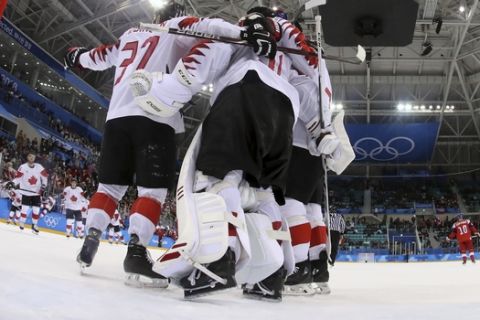 Canada hockey team celebrats after the men's bronze medal hockey game against the Czech Republic at the 2018 Winter Olympics in Gangneung, South Korea, Saturday, Feb. 24, 2018. Canada won 6-4. (Bruce Bennett/Pool Photo via AP)