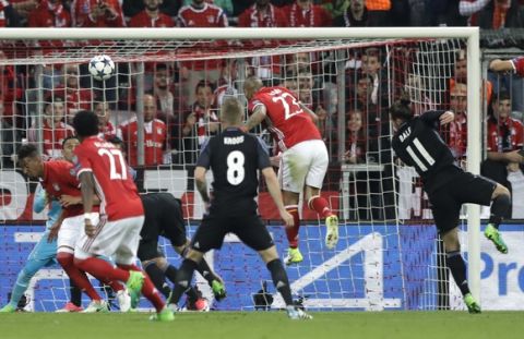 Bayern's Arturo Vidal scores the opening goal during the Champions League quarterfinal first leg soccer match between FC Bayern Munich and Real Madrid, in Munich, Germany, Wednesday, April 12, 2017. (AP Photo/Matthias Schrader)