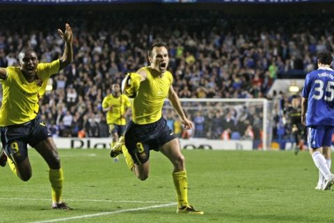 Barcelona's Andres Iniesta, center, celebrates with Samuel Eto'o after scoring his sides equalising goal during their Champions League semifinal second leg soccer match against Chelsea at Chelsea's Stamford Bridge stadium in London, Wednesday, May, 6, 2009. (AP Photo/ Matt Dunham)