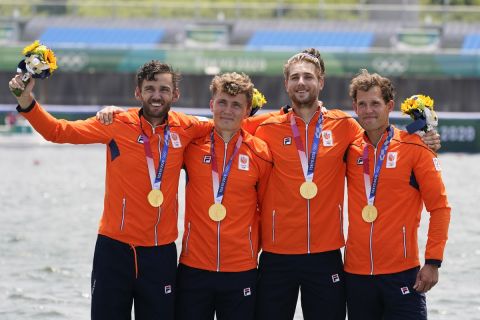 Lucas Theodoor Dirk Uittenbogaard, Abe Wiersma, Tone Wieten and Koen Metsemakers, of the Netherlands, pose with the gold medal following the men's rowing quadruple sculls final at the 2020 Summer Olympics, Wednesday, July 28, 2021, in Tokyo, Japan. (AP Photo/Darron Cummings)