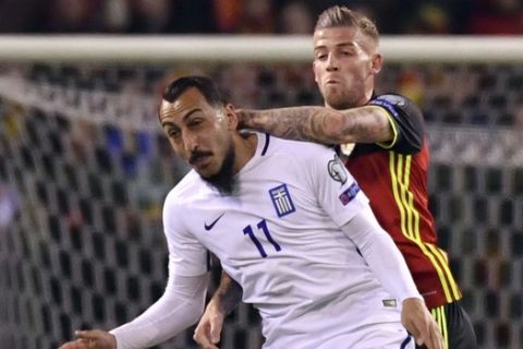 Belgium's Toby Alderweireld, right, goes us against Greece's Kostas Mitroglou during the Euro 2018 Group H qualifying match between Belgium and Greece at the King Baudouin stadium in Brussels on Saturday, March 25, 2017. (AP Photo/Geert Vanden Wijngaert)
