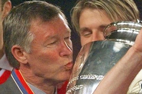 FILE - In this Wednesday, May 26, 1999 file photo Manchester United manager Alex Ferguson kisses the trophy after winning the Champions League final soccer match at the Nou Camp Stadium in Barcelona, Spain. Manchester United beat Bayern Munich 2-1. Manchester United said Wednesday May 8, 2013 that manager Alex Ferguson is retiring at the end of season. (AP Photo/Adam Butler, File)