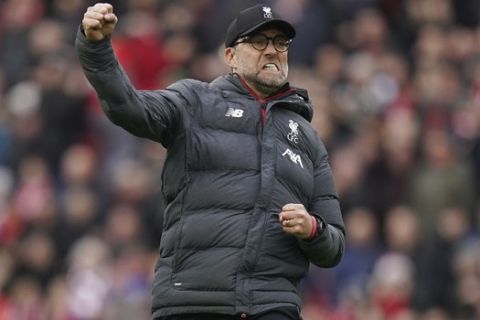 Liverpool's manager Jurgen Klopp celebrates at the end of the English Premier League soccer match between Liverpool and Bournemouth at Anfield stadium in Liverpool, England, Saturday, March 7, 2020. Liverpool won 2-1. (AP Photo/Jon Super)