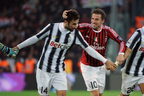 Juventus' forward Alessandro Del Piero (R) and Juventus' forward of Montenegro Mirko Vucinic celebrate their team's qualification for the final a the end of the return match of the semi finals of the Cup of Italy match between Juventus and AC Milan on March 20, 2012 in Juventus stadium in Turin. The match ended in a 2-2 draw. AFP PHOTO / OLIVIER MORIN (Photo credit should read OLIVIER MORIN/AFP/Getty Images)